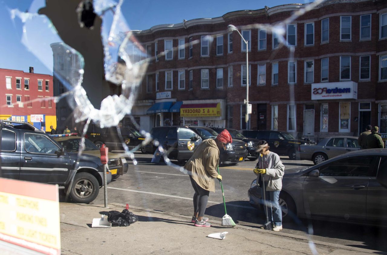 Two women sweep up the streets in Baltimore -- reflected in the broken window of a storefront on April 28. <a href="http://www.cnn.com/2015/04/29/us/gallery/baltimore-protests-cleanup/index.html">See more photos of the cleanup efforts.</a>