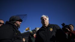 Maryland Gov. Larry Hogan greets Baltimore police dressed in riot gear the morning after citywide riots following the funeral of Freddie Gray, on April 28, 2015, in Baltimore, Maryland.