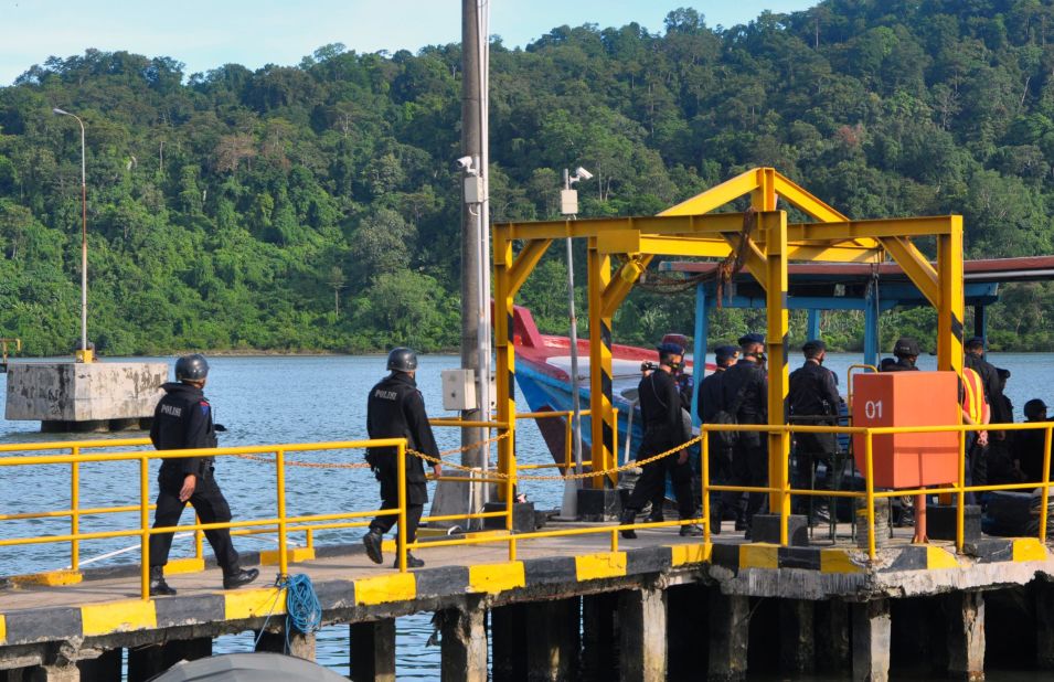 An Indonesian police firing squad boards a boat in Cilacap, Indonesia, to cross to the maximum security prison on Nusa Kambangan island on Tuesday, April 28, ahead of the execution of  drug convicts.