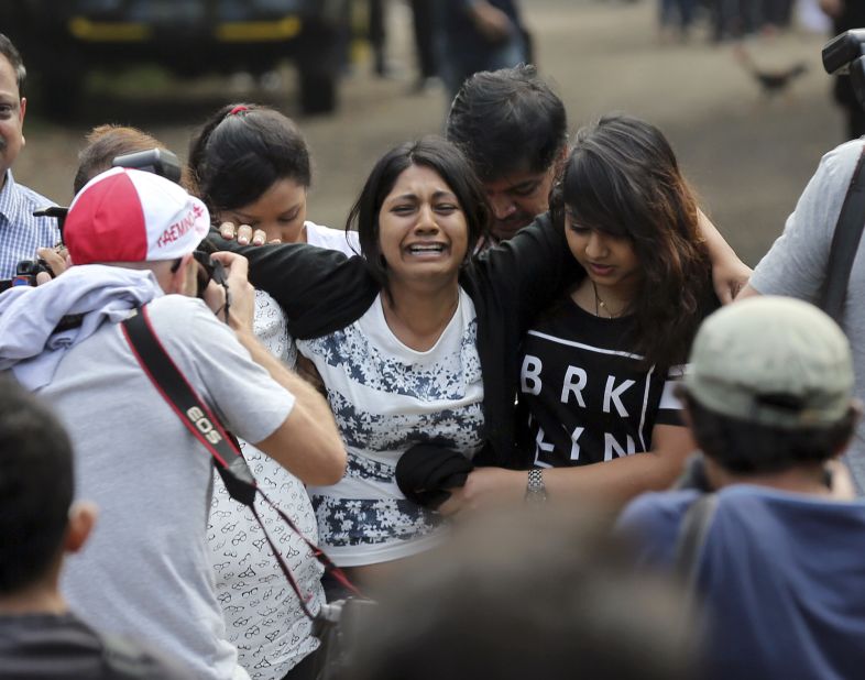 Brintha Sukumaran, center, sister of death row prisoner Myuran Sukumaran, cries upon arrival at the ferry port in Cilacap on April 28. 