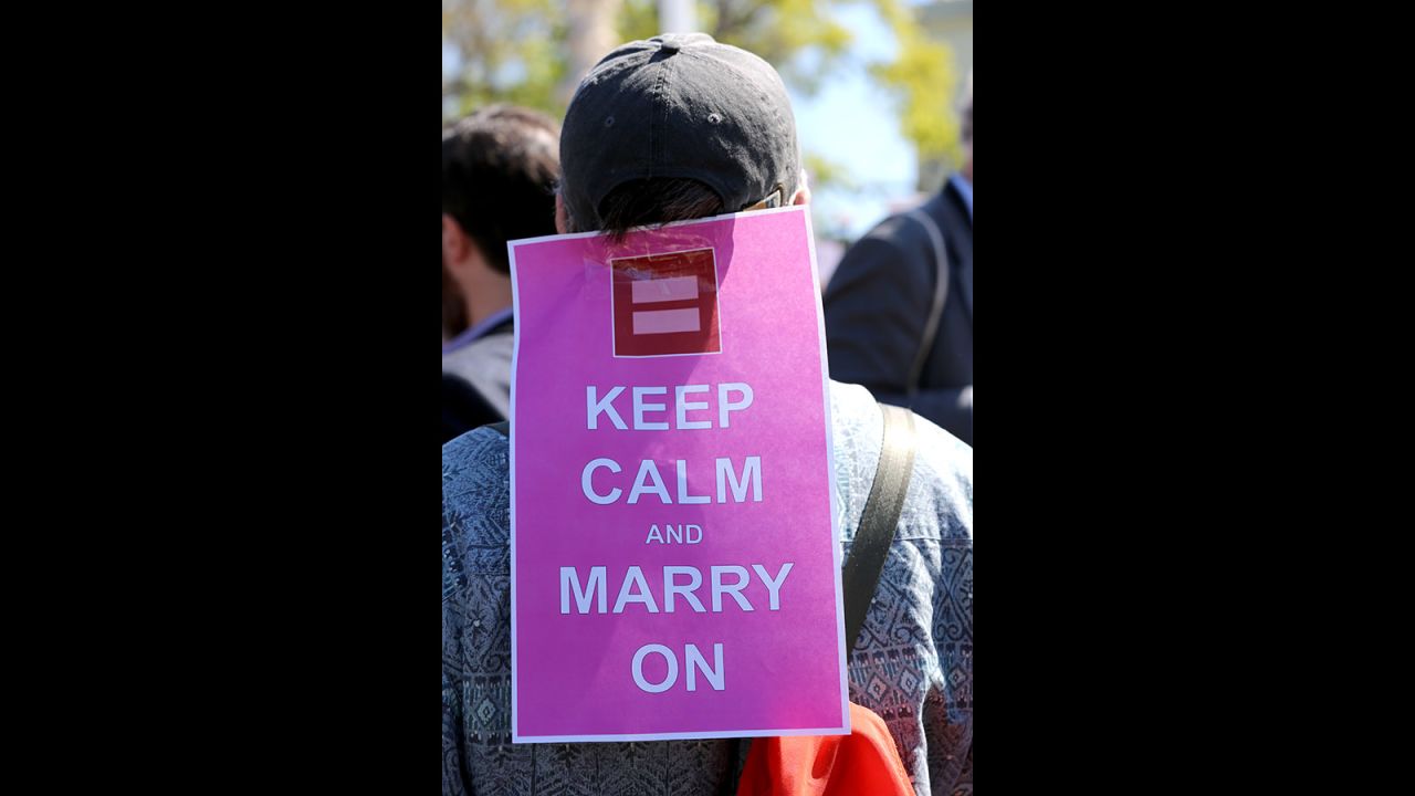 Kevin Rosseel of Washington stands outside the Supreme Court with his sign in support of same-sex marriage.