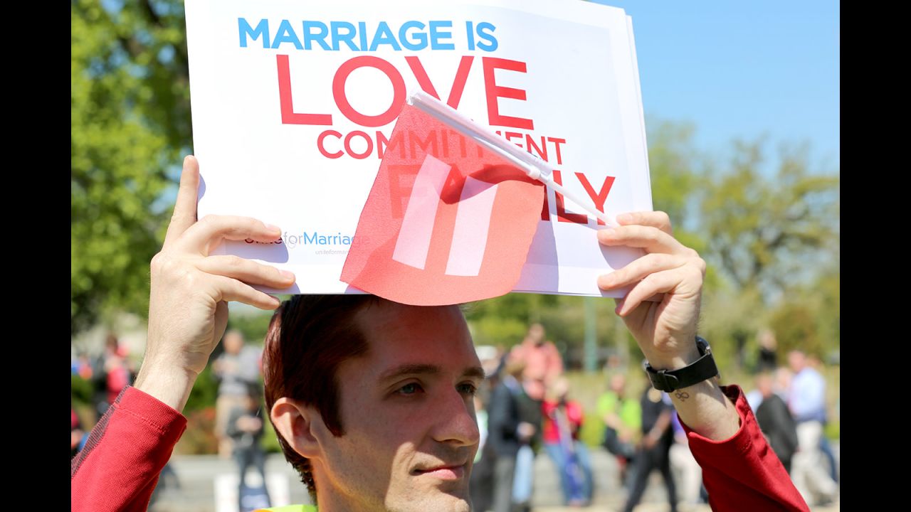 Andrew Zibell of Brooklyn, New York, holds a sign in front of the Supreme Court that shows his support of same-sex marriage. 