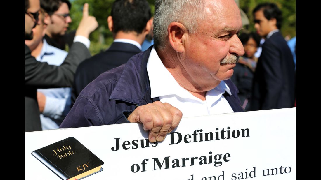 Pastor Larry Hickam holds a sign of what he says is the definition of marriage outside the Supreme Court.