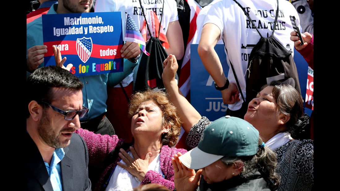 A group against same-sex marriage prays in an "appeal to heaven" outside the Supreme Court.