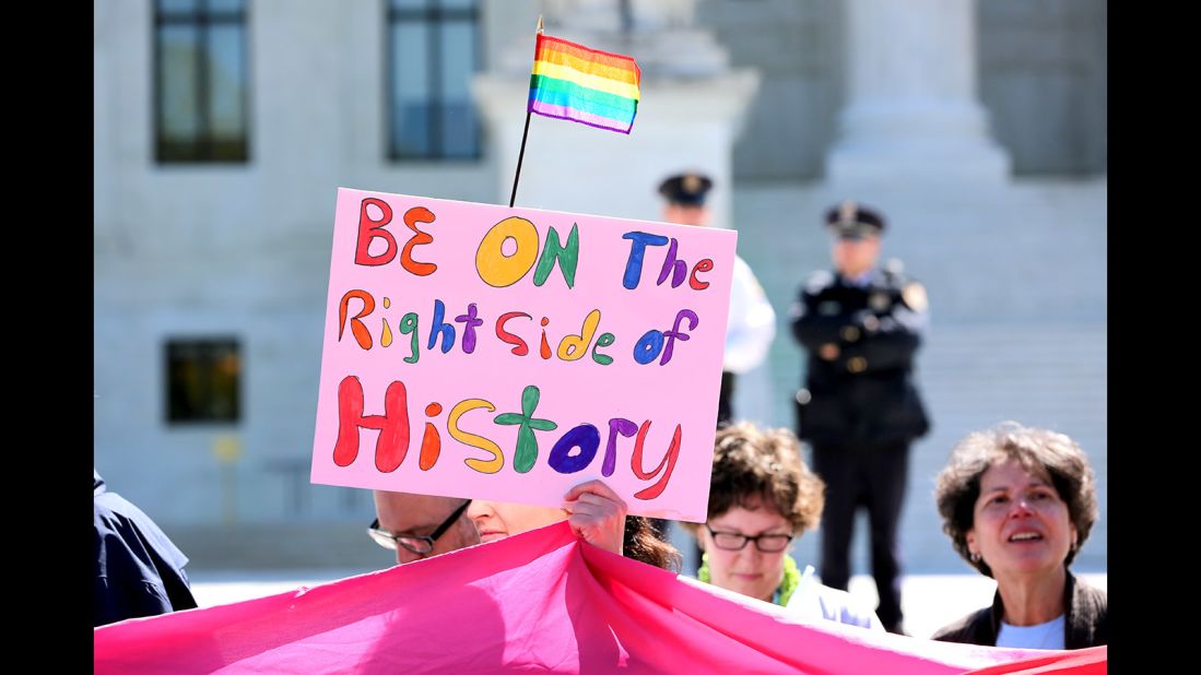 Catherine Quinn of Detroit holds up her sign supporting same-sex marriage outside the Supreme Court.