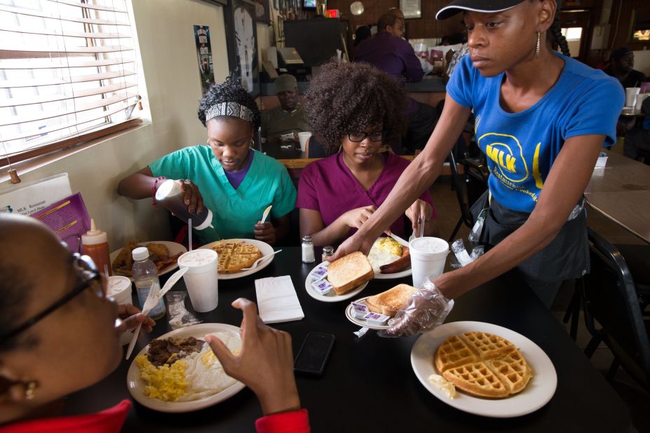 Other patrons enjoy breakfast at MLK Restaurant in Liberty City, a neighborhood in Miami.