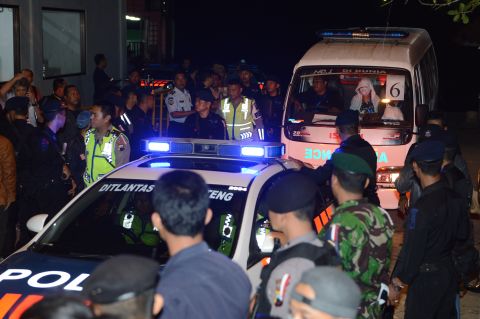 A police car escorts an ambulance carrying the coffin bearing the body of one of the eight executed drug convicts as it arrives in Nusakambangan port in Cilacap after the executions at Nusakambangan maximum security prison island on Wednesday, April 29. <a href="http://edition.cnn.com/2015/04/28/asia/indonesia-firing-squad-executions/" target="_blank"> Indonesia  executed eight convicted drug smugglers -- including two of the so-called "Bali Nine" -- the Reuters news agency reported, citing local media</a>, despite a firestorm of international criticism and last-ditch pleas by the condemned prisoners' families. 