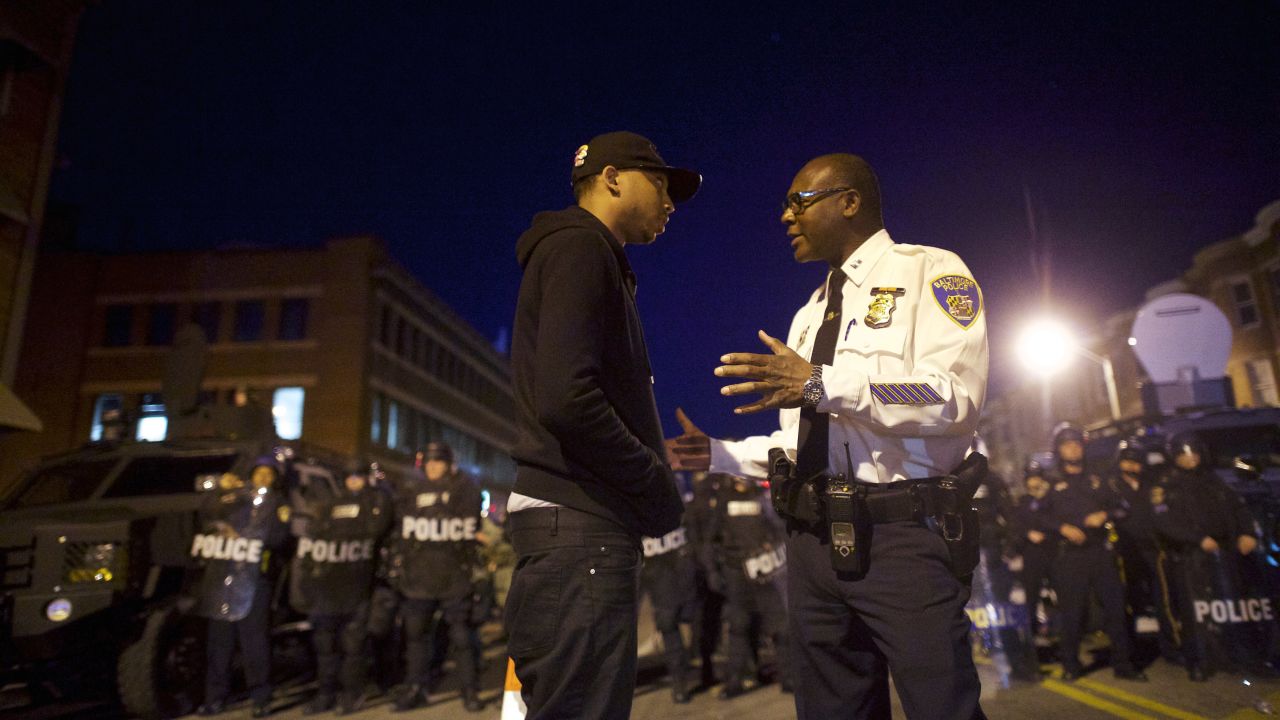 A Baltimore police captain tries to calm a protester on April 28.