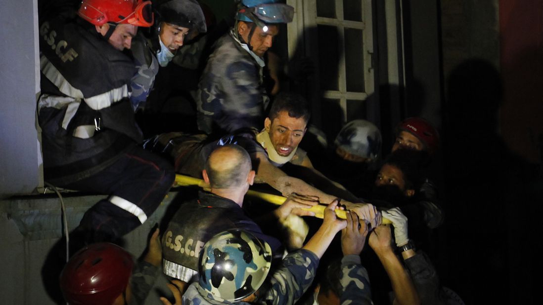 A man is freed from the ruins of a hotel by French rescuers in the Gangabu area of Kathmandu on Tuesday, April 28. Reuters identified the man as Rishi Khanal.