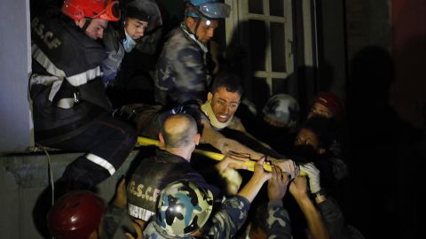 A man is freed from the ruins of a hotel by French rescuers in the Gangabu area of Kathmandu on Tuesday, April 28. Reuters identified the man as Rishi Khanal.
