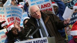Sanders speaks to low-wage federal contract workers during a protest where the workers demanded presidential action to win an increase to $15 an hour wage on December 4, 2014, in Washington, D.C.