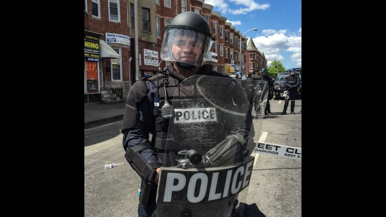 When his class was there, riot officers restrained and carried away someone, Larson says. The crowd scattered in fear and then regrouped cautiously. Police put a sniper team on a nearby roof and a helicopter buzzed above. "My students no longer felt safe and we decided to leave as a group," he says. "My heart was very heavy on leaving."