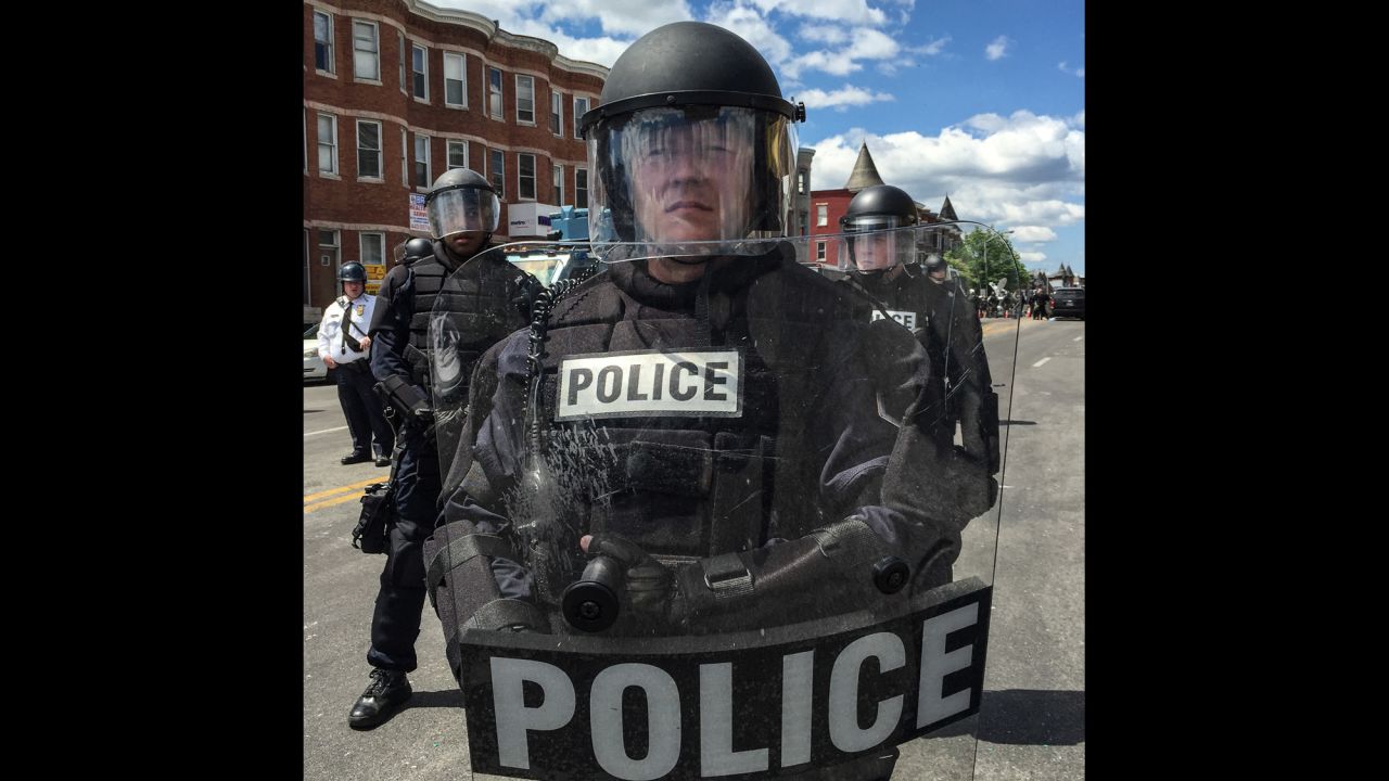 In all, there were "27 officers standing shoulder to shoulder in full riot gear," Larson says.