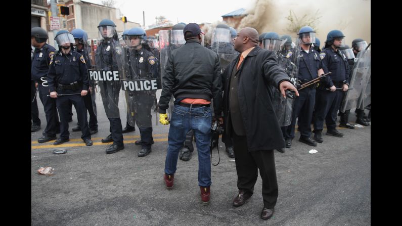 A man attempts to calm a fellow demonstrator as they face police in Baltimore in April 2015. Riots broke out after <a href="index.php?page=&url=http%3A%2F%2Fwww.cnn.com%2F2015%2F04%2F27%2Fus%2Fgallery%2Ffreddie-gray-funeral%2Findex.html">the funeral for Freddie Gray</a>, who died of a severe spinal cord injury while in police custody. His death sparked <a href="index.php?page=&url=http%3A%2F%2Fwww.cnn.com%2F2015%2F04%2F23%2Fus%2Fgallery%2Ffreddie-gray-protest%2Findex.html">protests in Baltimore</a> and raised long-simmering tensions between police and residents.