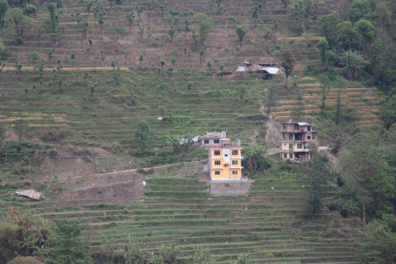 Collapsed buildings among the terraced fields of Melamchi, a village in Sindhupalchok District, central Nepal. Officials say 1,376 people in the district died as a result of the earthquake.