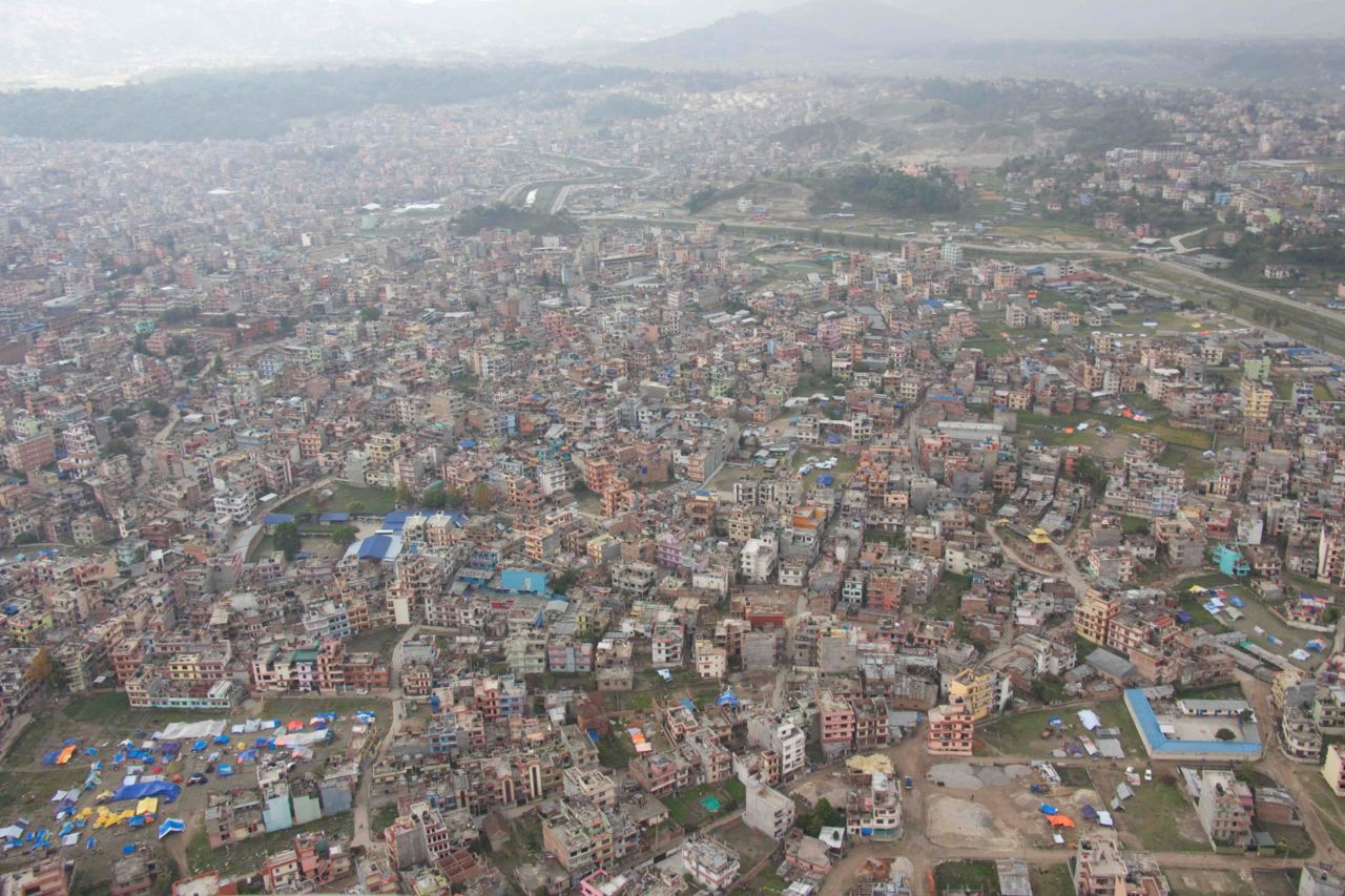Kathmandu viewed from above. The tents seen at the bottom left house people who have been displaced from their homes because of the quake. Many people in the city are sleeping outside, fearful that their homes could crumble if an aftershock strikes.