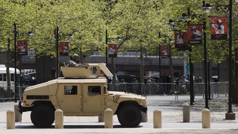 A National Guard vehicle passes Oriole Park. 