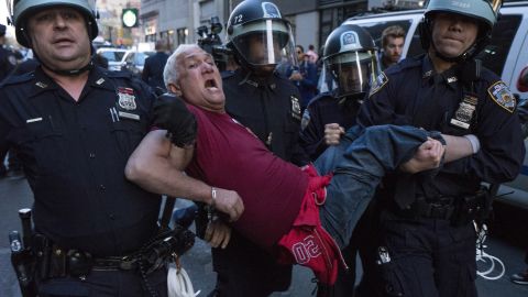 A man is carried by police officers as arrests are made at New York's Union Square on Wednesday.