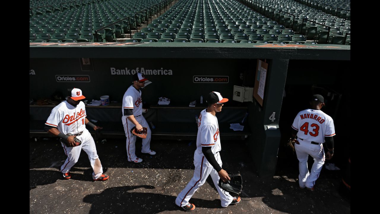Orioles players walk into the clubhouse after defeating the White Sox 8-2.