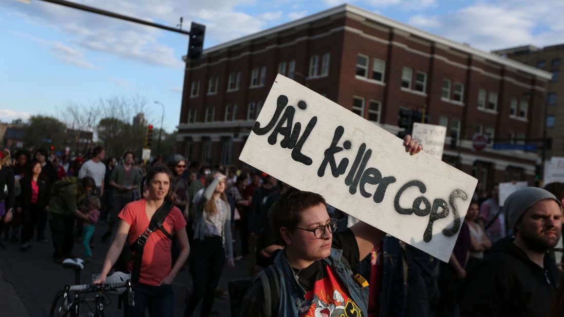 People in Minneapolis march during a rally on April 29.