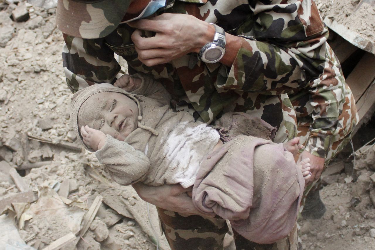 The newspaper that provided photographs of the baby's rescue says the Nepalese army initially left the site, thinking the baby had not survived. Hours later when the infant's cries were heard, soldiers came back and rescued him.