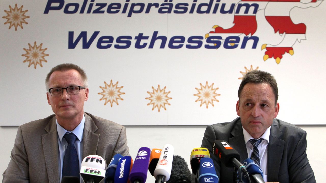 Albrecht Schreiber, left, Frankfurt's attorney general, and Stefan Mueller, head of the police department in Wiesbaden, Germany, address the media during a news conference in Wiesbaden.