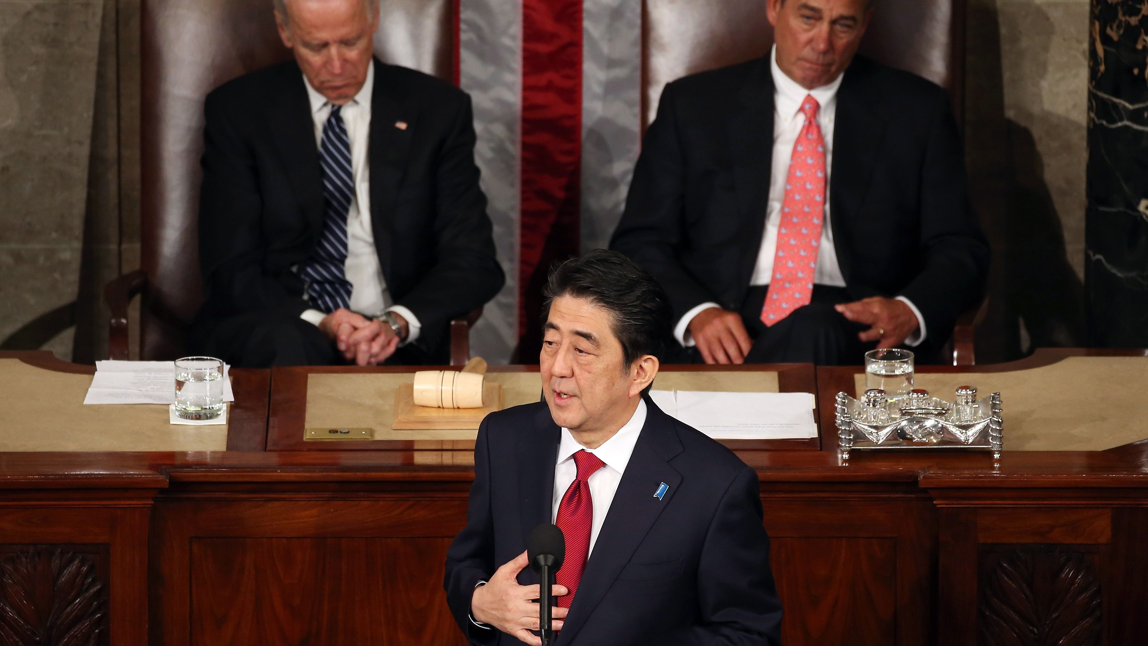 Japanese PM Shinzo Abe speaks to Congress flanked by Vice President Joe Biden (L) and House Speaker John Boehner.