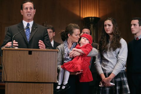 Santorum voices opposition to the United Nations Convention on the Rights of Persons with Disabilities during a press conference on Capitol Hill on November 26, 2012, with his wife, Karen Santorum, and their three children.  Their daughter Isabella, being held by his wife, was born with a serious genetic disorder.