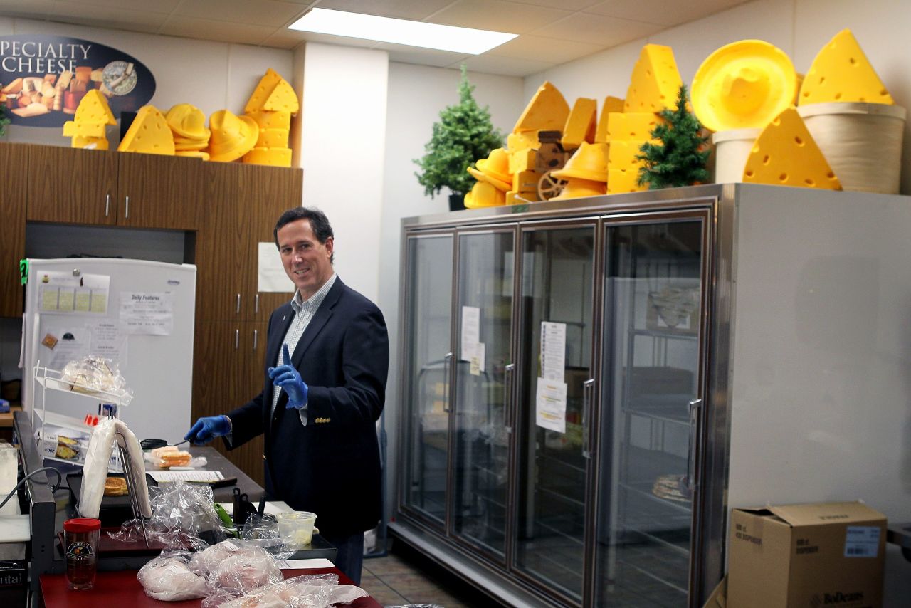 Santorum makes a grilled cheese sandwich during a campaign stop at Simons Specialty Cheese on April 2, 2012, in Appleton, Wisconsin.