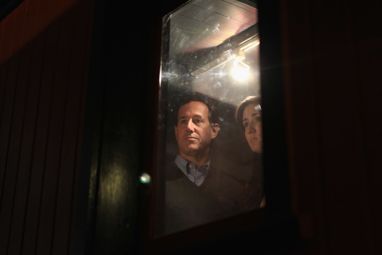 Santorum tours a vintage train car with his daughter Sarah during a campaign stop at the National Railroad Museum on April 1, 2012, in Green Bay, Wisconsin.