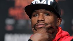 Caption:WBC/WBA welterweight champion Floyd Mayweather Jr. listens during a news conference at the KA Theatre at MGM Grand Hotel & Casino on April 29, 2015 in Las Vegas, Nevada. Mayweather will face WBO welterweight champion Manny Pacquiao in a unification bout on May 2, 2015 in Las Vegas. AFP PHOTO / JOHN GURZINSKI (Photo credit should read JOHN GURZINSKI/AFP/Getty Images)