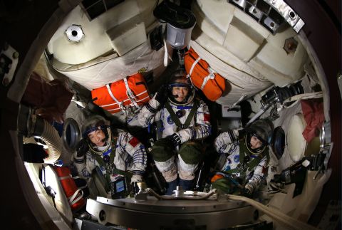 Zhang, left, Nie, center, and Wang, right,  during a training session in the return capsule.