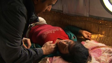 Dr. Sanjay Gupta checks Sabina's pulse on board a helicopter flight from her quake-hit village, April 30, 2015.