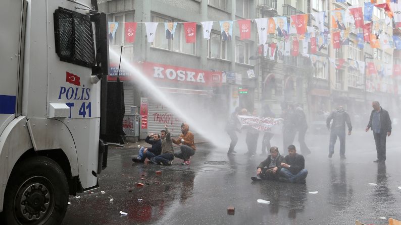 Police use water cannons on May Day demonstrators in Istanbul, Turkey, on Friday, May 1. Clashes erupted between police and protesters, who defied a government ban  on marching to Taksim Square. Rallies around the world marked <a href="index.php?page=&url=http%3A%2F%2Fwww.cnn.com%2F2013%2F09%2F03%2Fworld%2Fmay-day-fast-facts%2Findex.html">May Day</a>, referred to as International Workers' Day in many countries.