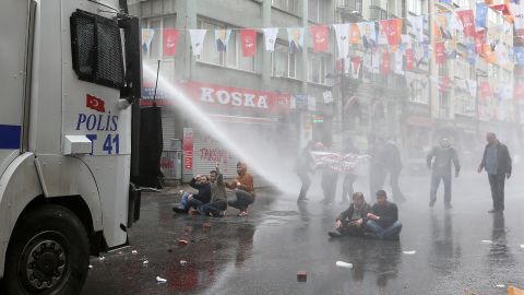 Police use water cannons on May Day demonstrators in Istanbul, Turkey, on Friday, May 1. Clashes erupted between police and protesters, who defied a government ban  on marching to Taksim Square. Rallies around the world marked <a href="http://www.cnn.com/2013/09/03/world/may-day-fast-facts/index.html">May Day</a>, referred to as International Workers' Day in many countries.