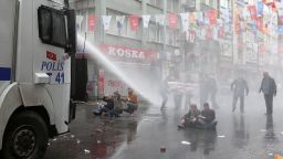Police use water cannons on May Day demonstrators in Istanbul, Turkey, on Friday, May 1. Clashes erupted between police and protesters who defied a government ban and tried to march to the city's iconic Taksim Square.