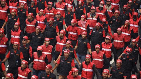 Labor union members join workers and activists in Jakarta, Indonesia. Protesters were demanding better working conditions.