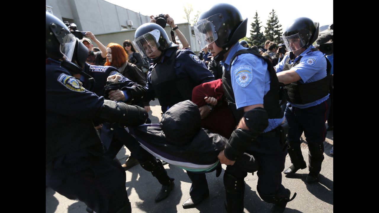 Police detain a man at the May Day rally  organized by the Communist Party of Ukraine in Kiev.