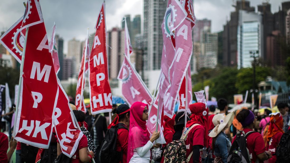 Migrant workers gather in Hong Kong to call for better working conditions.