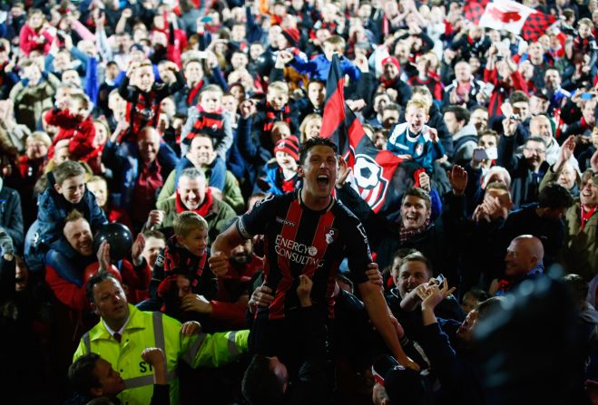 The team usually walk off the pitch but captain Tommy Elphick and other Bournemouth stars had to be carried off when promotion was secured. 