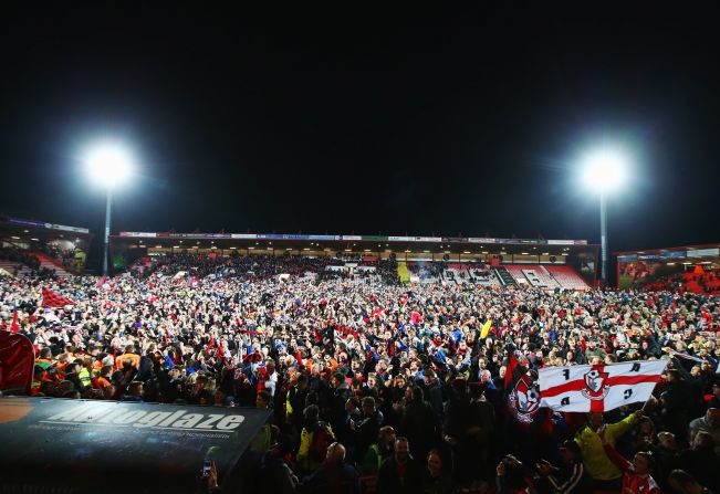 Bournemouth's victory against Bolton sparked a mass pitch invasion at the final whistle when the 125-year wait for top-flight football ended in jubilant fashion.