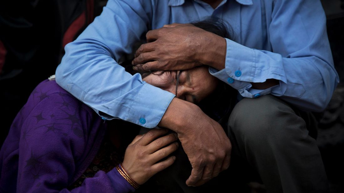 A woman receives comfort during the funeral of her mother, a victim of Nepal's deadly earthquake, on Friday, May 1, in Kathmandu.
