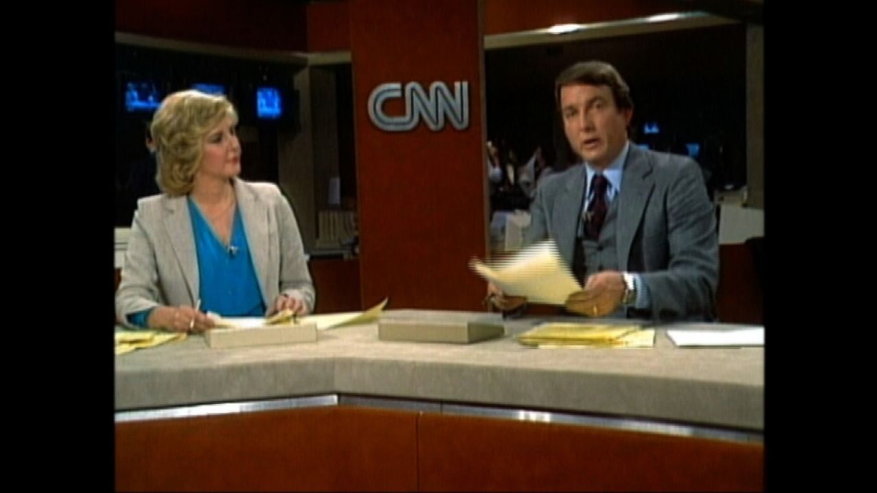 Happy birthday, CNN! The world's first 24-hour news network came to life on June 1, 1980. Husband-and-wife duo Lois Hart and Dave Walker anchored the first broadcast. Click through this gallery to see how the sets and graphics have changed. The following images are from around June of each year. 
