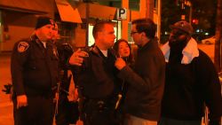 A Baltimore police officer confronts CNN's Miguel Marquez over where the media can stand during curfew.