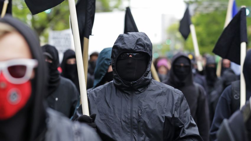 Black-clad protesters take part in a May Day anti-capitalism march, Friday, May 1, 2015 in Seattle. (AP Photo/Ted S. Warren)
