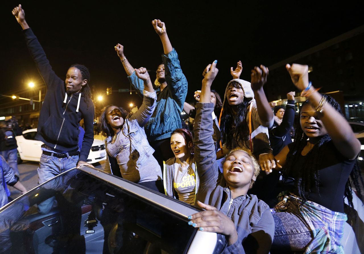 Demonstrators celebrate the announcement that six officers were charged May 1 in Gray's death. 
