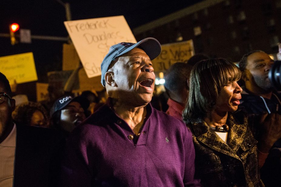 U.S. Rep. Elijah Cummings, D-Maryland, helps clear Baltimore streets of protesters on May 1.