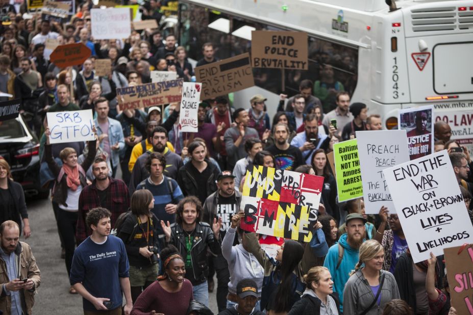 Demonstrators march through the streets of Baltimore after the charges against the officers were announced May 1. 