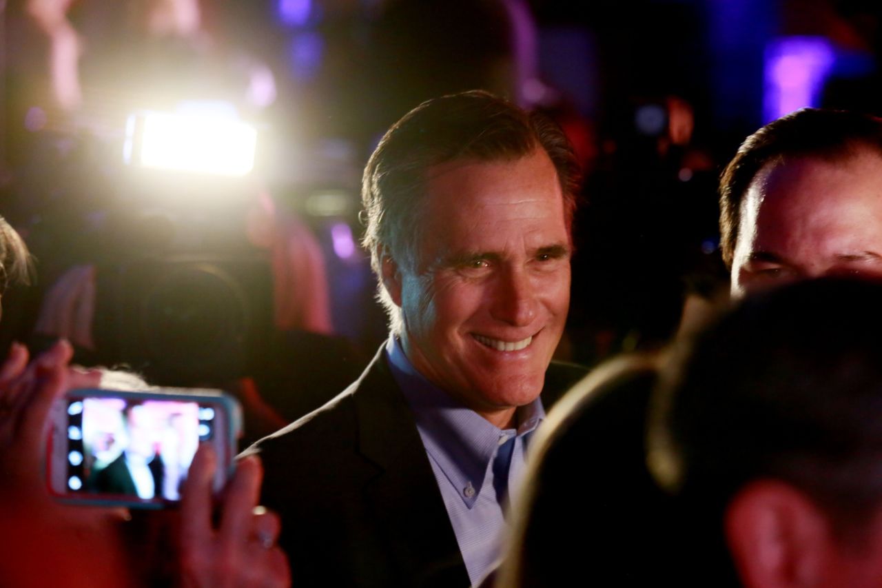 Former GOP presidential nominee Mitt Romney is pictured greeting fellow Republicans at a dinner during the RNC Annual Winter Meeting aboard the USS Midway on January 16 in San Diego. During Romney's 2012 presidential campaign, the Koch brothers hosted a fundraiser where the tickets reportedly were $50,000 each.