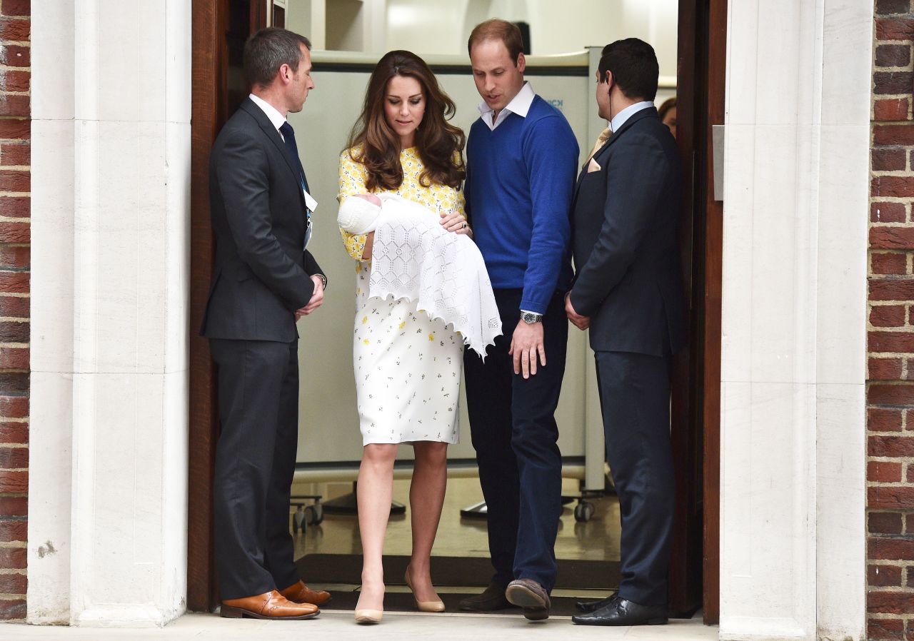 William and Catherine present their newborn daughter as they leave a London hospital in May 2015.